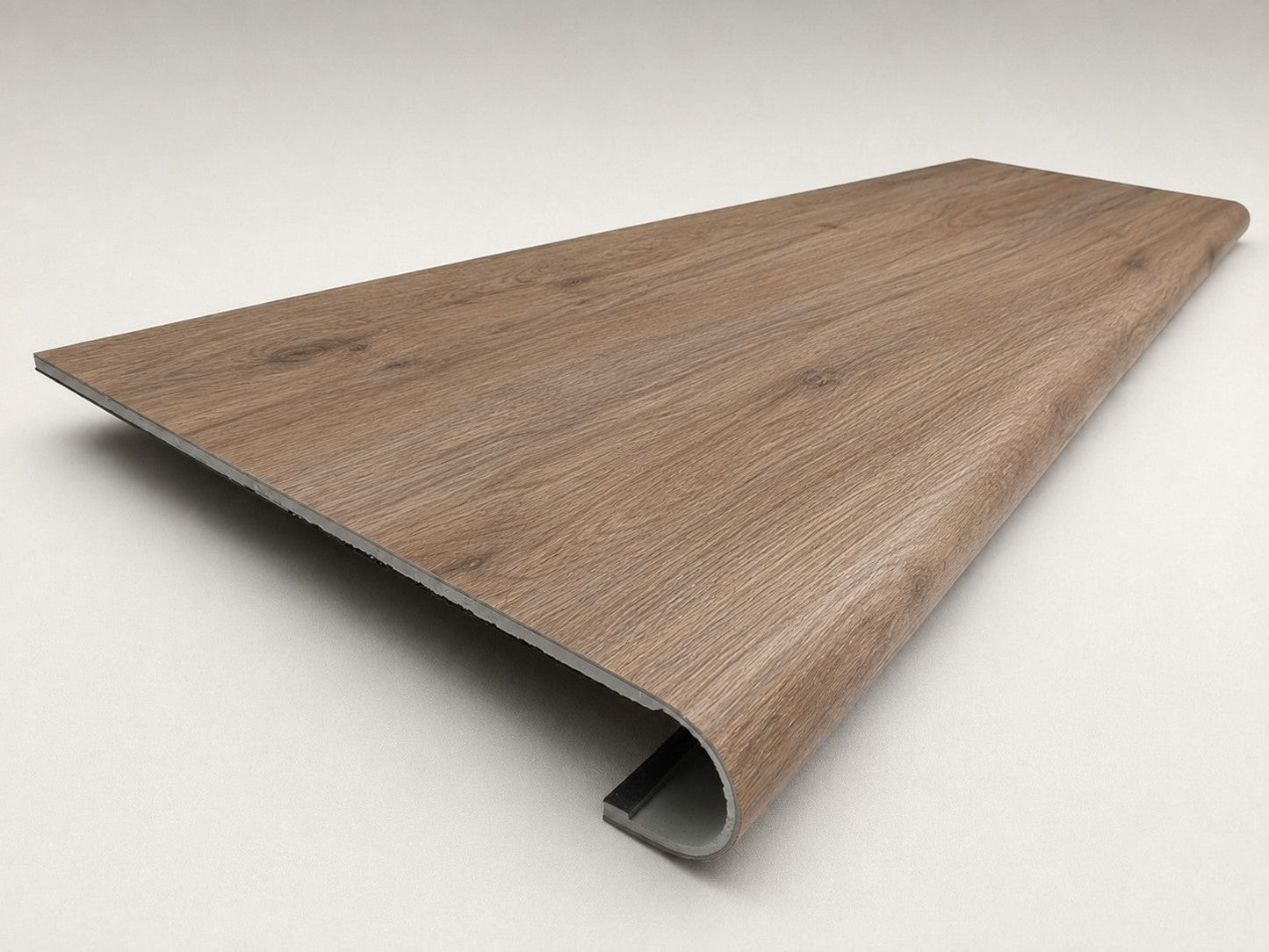 Custom round-nose stair tread made from A&A Surfaces Forrest Brown flooring. Round profile. Angled view.