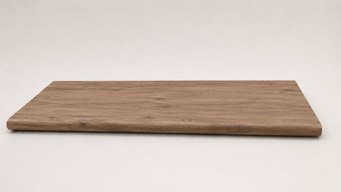 Custom round-nose stair tread made from A&A Surfaces Forrest Brown flooring. Round profile. Full view.