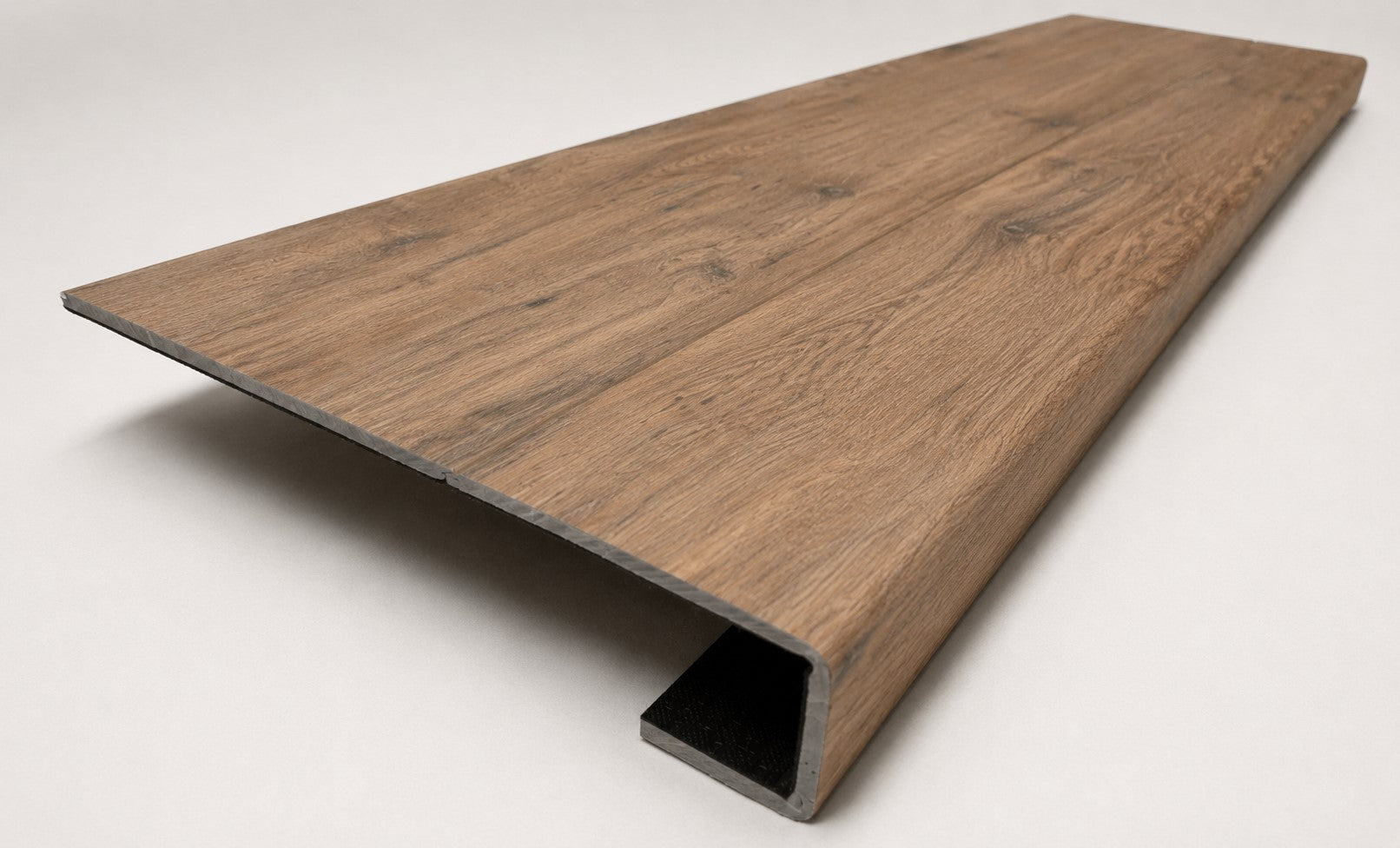 Custom square nose stair tread made with A&A Surfaces Forrest Brown flooring, featuring a continuous wood-look surface for a clean, professional stair update. Angled View