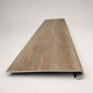 Custom round-nose stair tread made from DuraLux Performance Alamo Oak flooring. Round profile. Front view.
