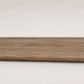 Custom round-nose stair tread made from DuraLux Performance Alamo Oak flooring. Round profile. Full view.