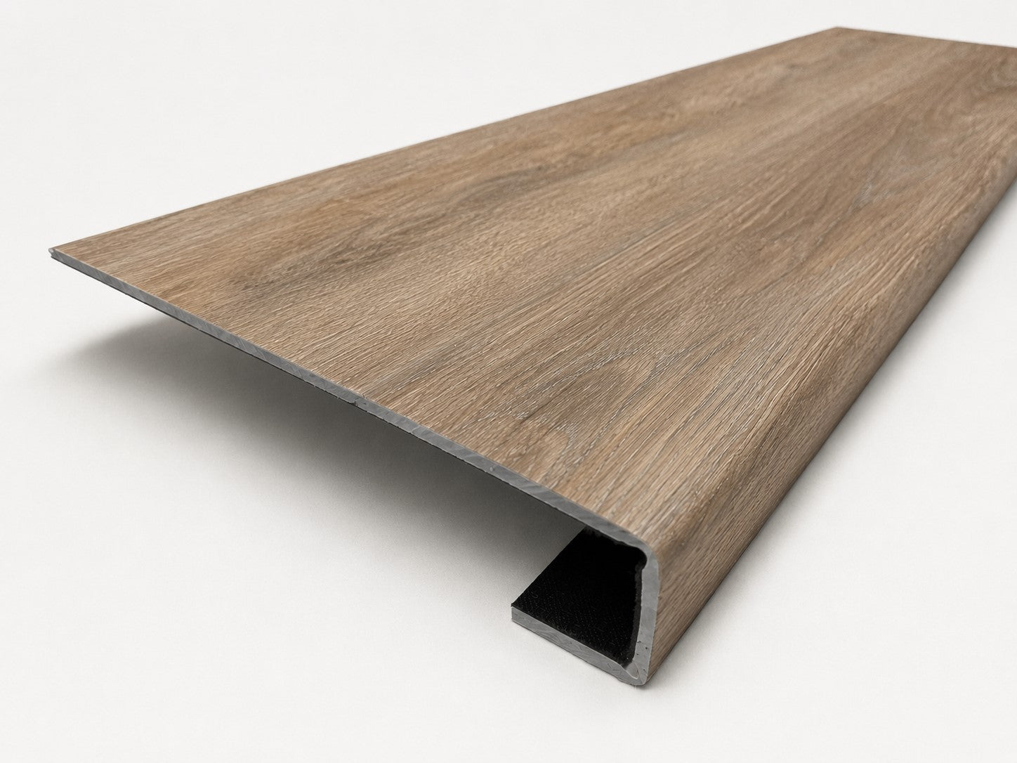 Custom square-nose stair tread made from DuraLux Performance Alamo Oak flooring. Square profile. Angled view.