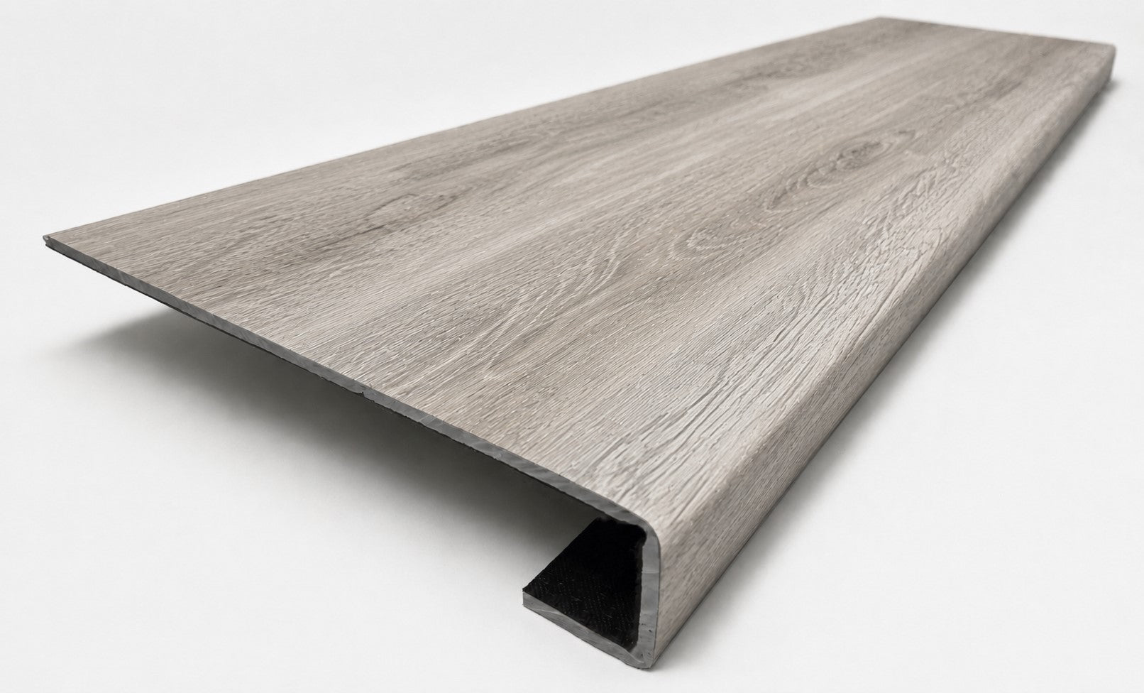Custom square-nose stair tread made from DuraLux Performance Highguard Silver flooring. Square profile. Angled view.
