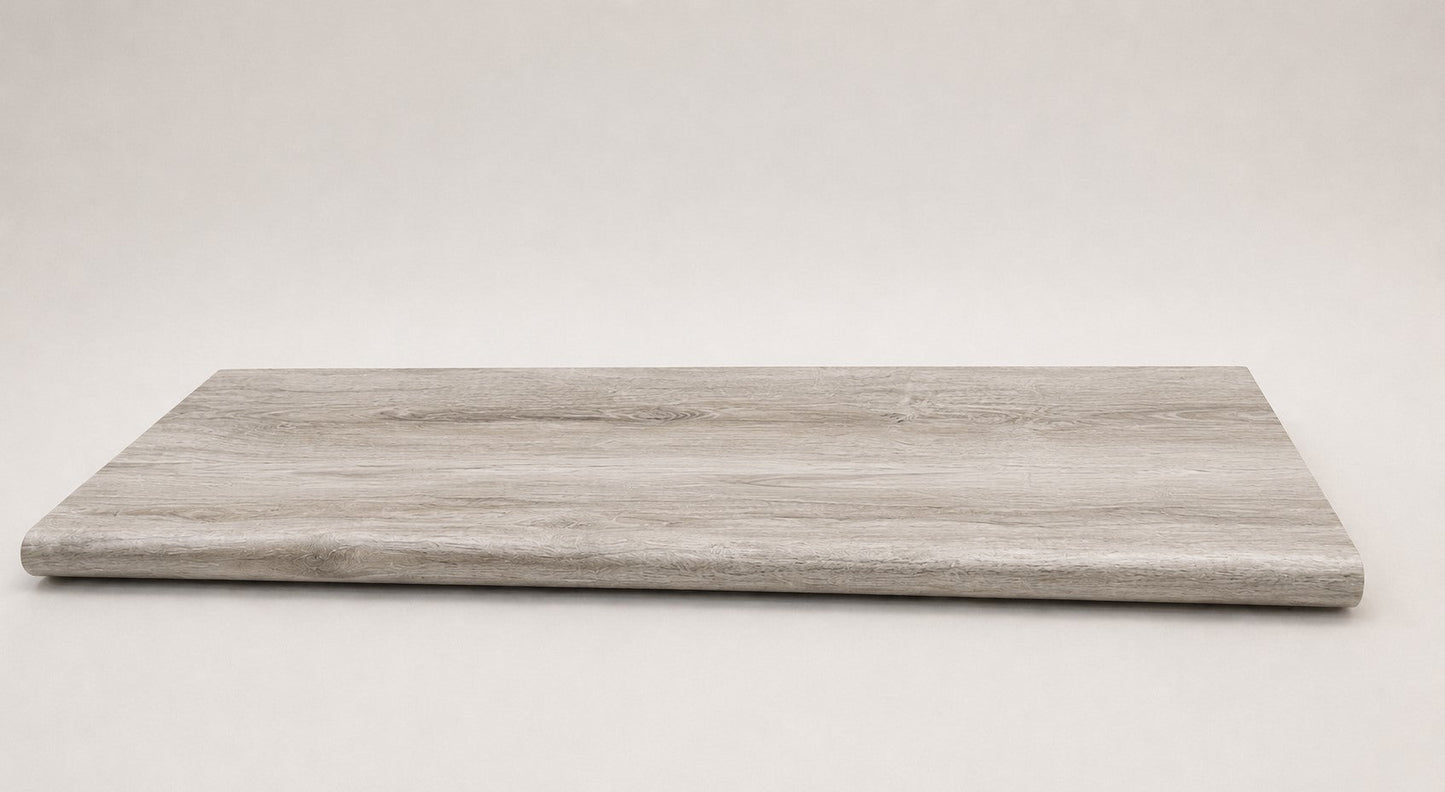 Custom round-nose stair tread made from DuraLux Performance Highguard Silver flooring. Round profile. Full view.
