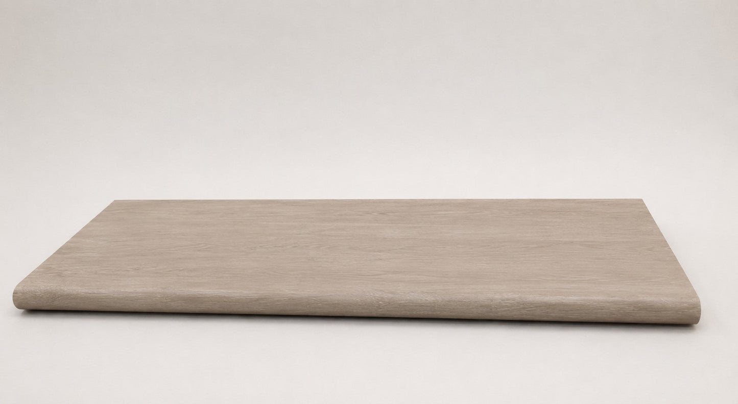 Custom round-nose stair tread made from DuraLux Performance Lorraine Sienna flooring. Round profile. Full view.