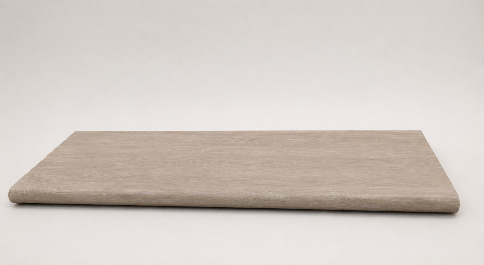Custom round-nose stair tread made from DuraLux Performance Lorraine Sienna flooring. Round profile. Full view.