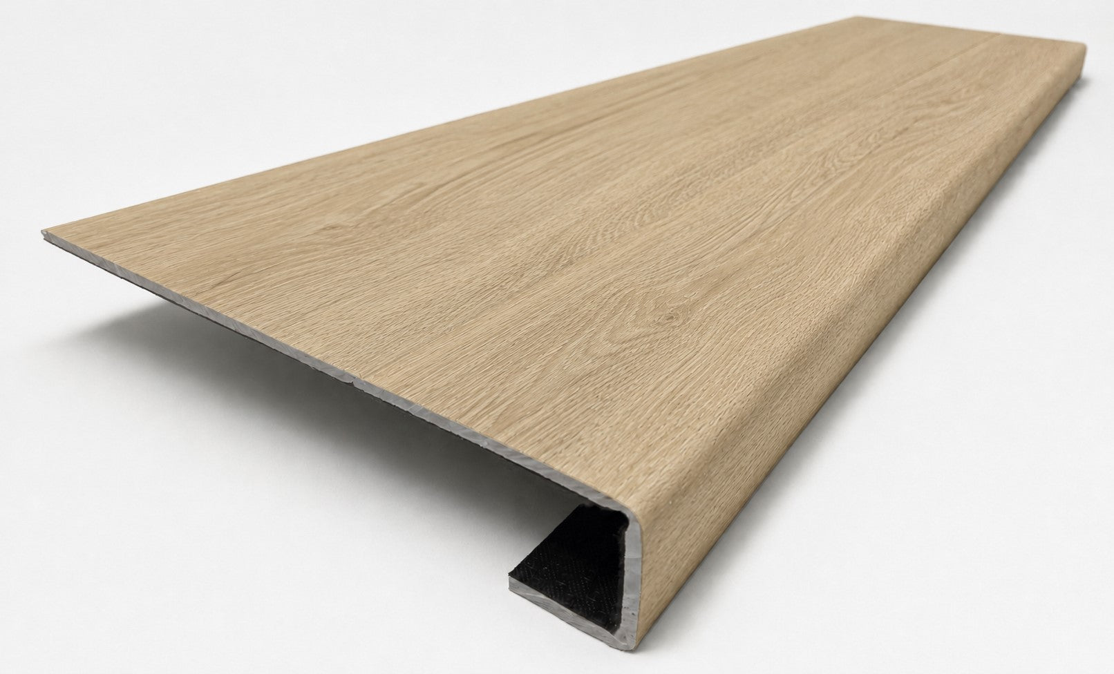 Custom square-nose stair tread made from DuraLux Performance Paisley Cape flooring. Square profile. Angled view.