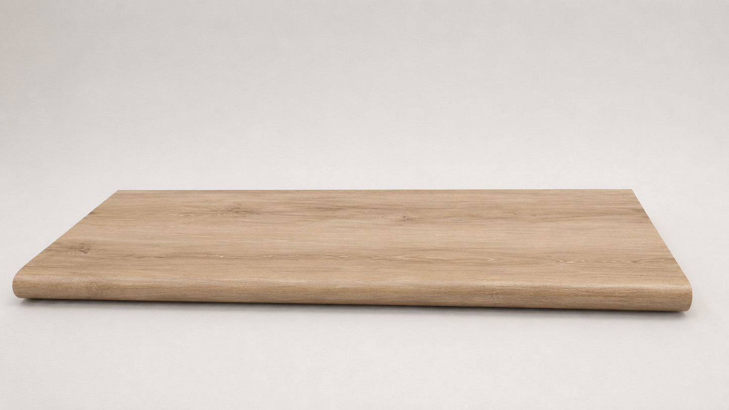 Custom round-nose stair tread made from DuraLux Performance Piedmont Bend flooring. Round profile. Full view.