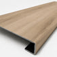 Custom square-nose stair tread made from DuraLux Performance Piedmont Bend flooring. Square profile. Angled view.
