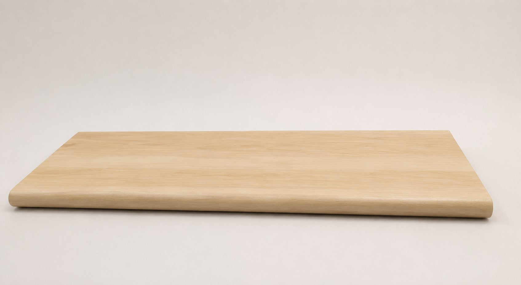 Custom round-nose stair tread made from DuraLux Performance Poplar Trace flooring. Round profile. Full view.
