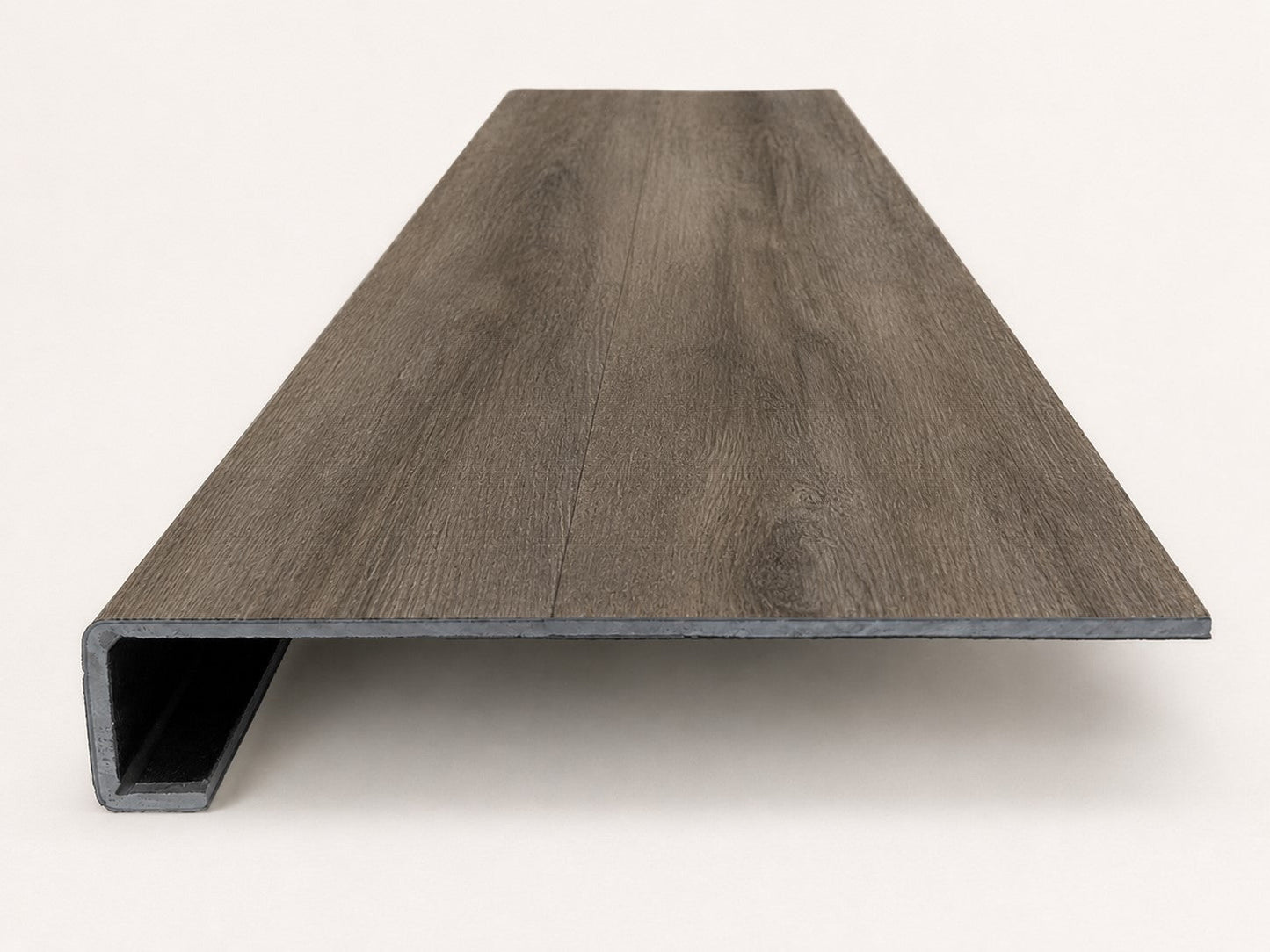 Custom square-nose stair tread made from DuraLux Performance Stormy Elm flooring. Square profile. Front view.