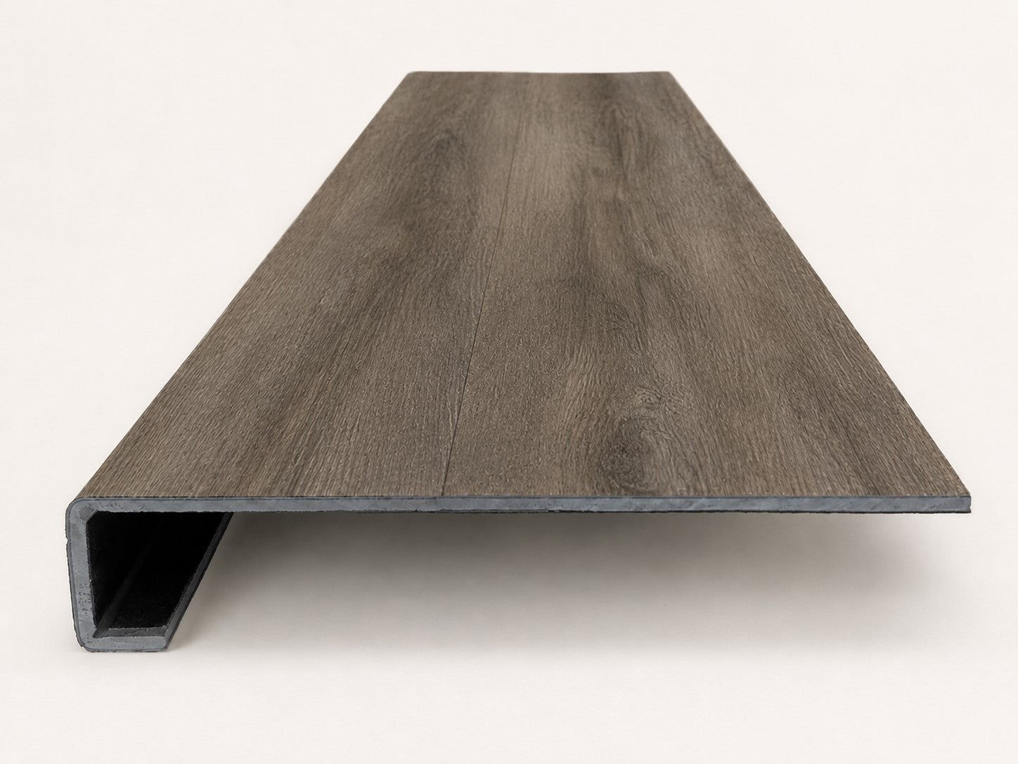 Custom square-nose stair tread made from DuraLux Performance Stormy Elm flooring. Square profile. Front view.