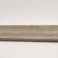 Custom round-nose stair tread made from DuraLux Performance Timber Saddle flooring. Round profile. Full view.