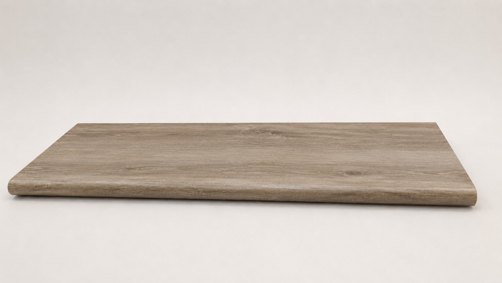 Custom round-nose stair tread made from DuraLux Performance Timber Saddle flooring. Round profile. Full view.