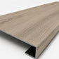 Custom square-nose stair tread made from DuraLux Performance Timber Saddle flooring. Square profile. Angled view.
