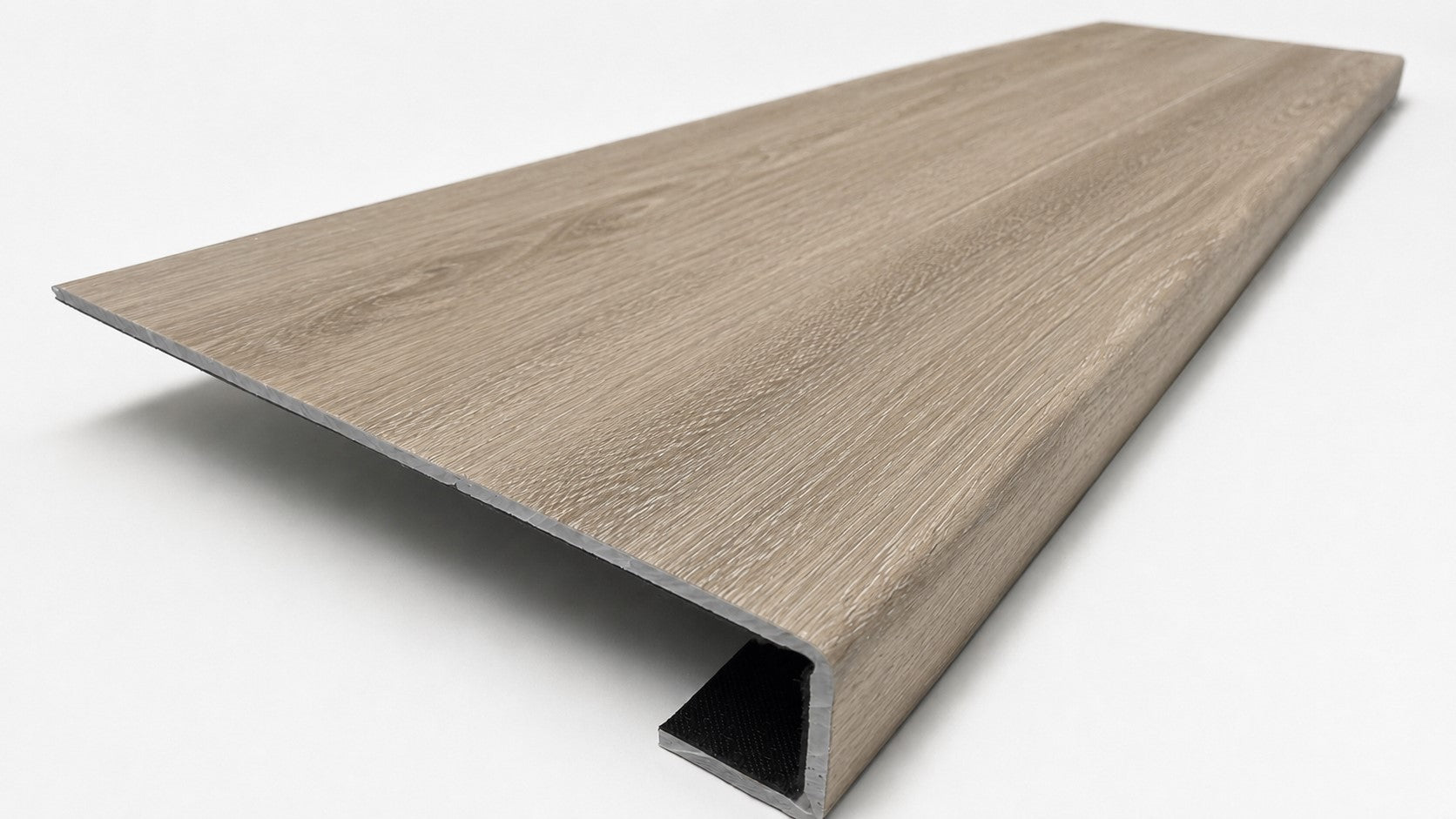 Custom square-nose stair tread made from DuraLux Performance Timber Saddle flooring. Square profile. Angled view.