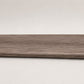 Custom round-nose stair tread made from DuraLux Performance Winter Peak flooring. Round profile. Full view.