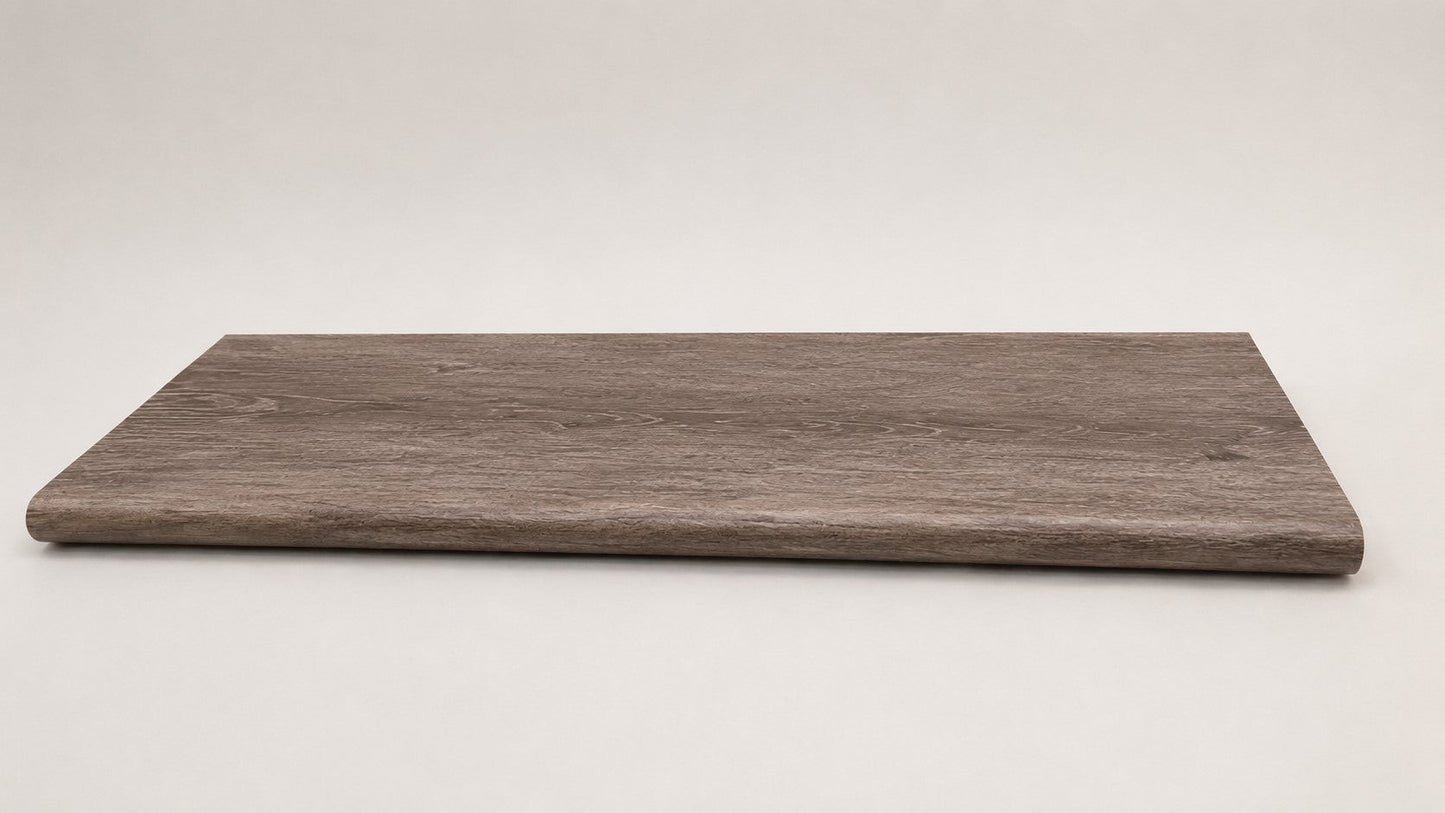 Custom round-nose stair tread made from DuraLux Performance Winter Peak flooring. Round profile. Full view.