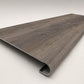 Custom round-nose stair tread made to match LifeProof Bradbury Hill flooring, with a weathered wood-look finish, continuous grain, and a smooth rounded profile for a finished stair edge. Angled View