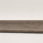 Custom round-nose stair tread made to match LifeProof Bradbury Hill flooring, with a weathered wood-look finish, continuous grain, and a smooth rounded profile for a finished stair edge. Front View