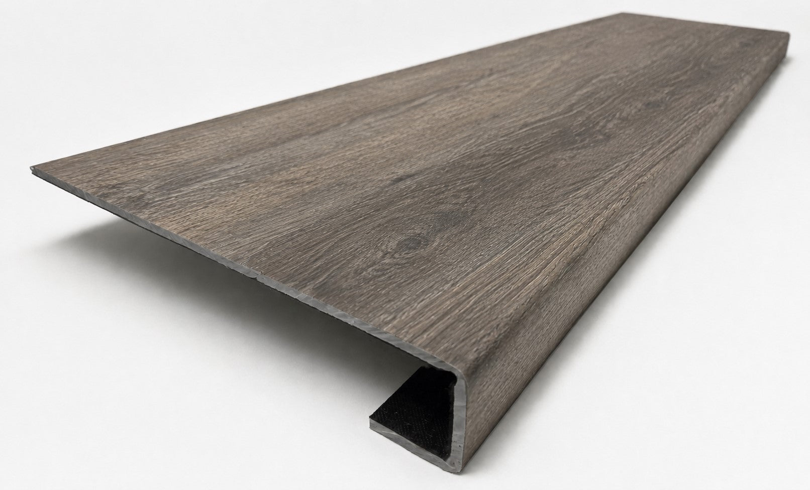 Custom square-nose stair tread made to match LifeProof Bradbury Hill flooring, with a weathered wood-look finish, continuous grain, and a square profile for a finished stair edge. Angled View
