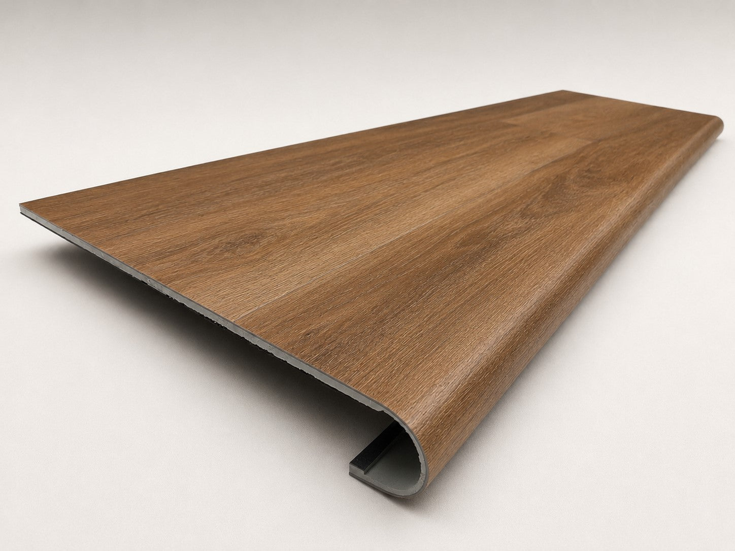 Custom round-nose stair tread made to match LifeProof Butler Hickory flooring. Round profile. Angled view.