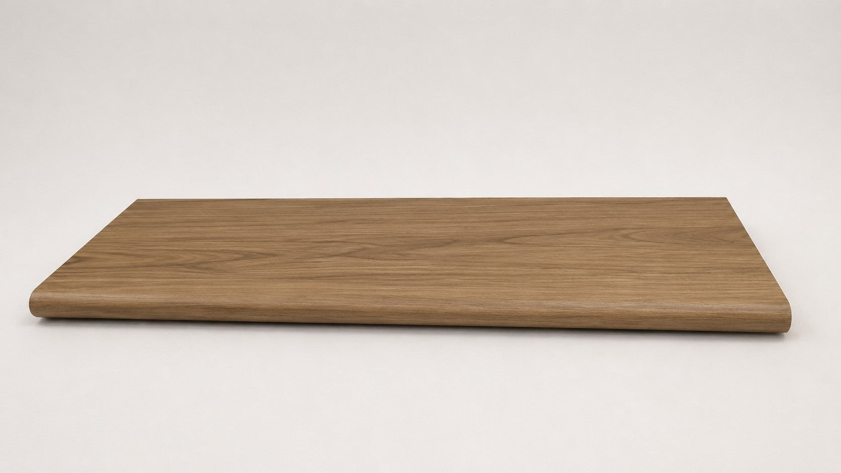 Custom round-nose stair tread made from LifeProof Clermont Elm flooring. Round profile. Full view.