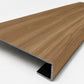 Custom square-nose stair tread made from LifeProof Clermont Elm flooring. Square profile. Angled view.