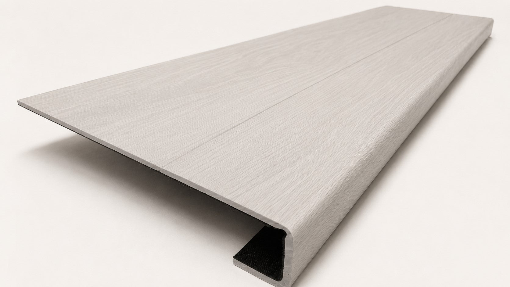 Custom square-nose stair tread made from LifeProof Driftwood Beach Oak flooring. Square profile. Angled view.