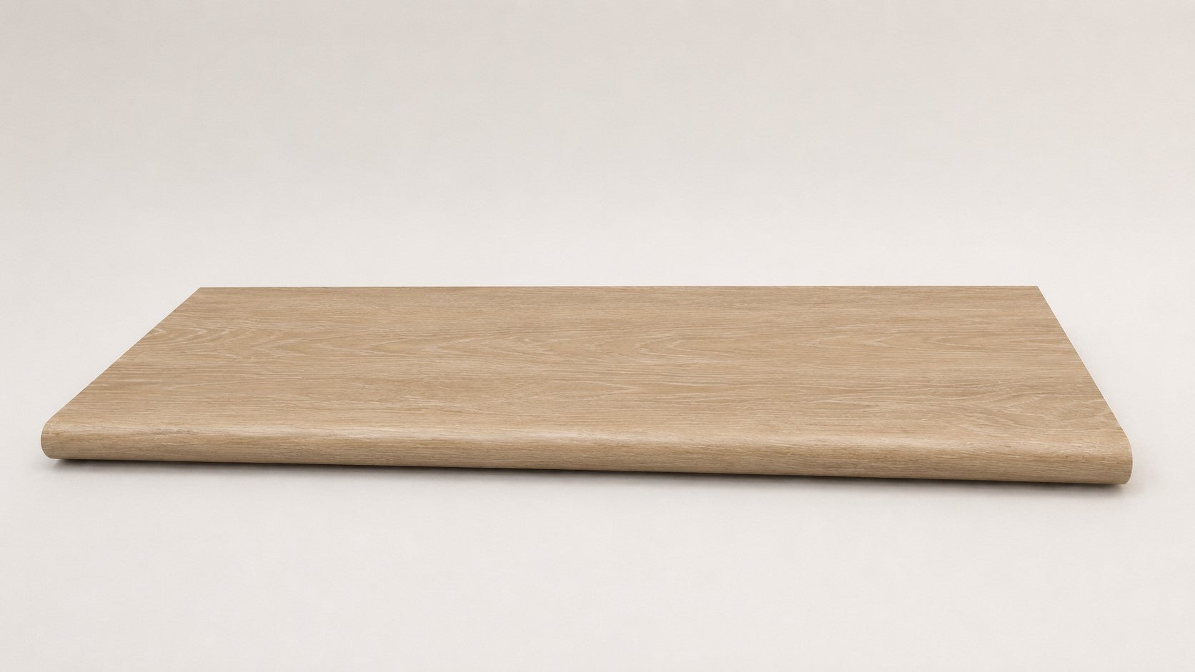 Custom round-nose stair tread made from LifeProof Dusk Cherry flooring. Round profile. Full view.
