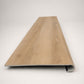 Custom round-nose stair tread made from LifeProof Fresh Oak flooring. Round profile. Front view.
