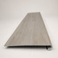 Custom round-nose stair tread made from LifeProof Kacee Canyon Oak flooring. Round profile. Front view.