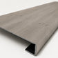 Custom square-nose stair tread made from LifeProof Kacee Canyon Oak flooring. Square profile. Angled view.
