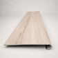 Custom round-nose stair tread made from LifeProof Navarra Maple Oak flooring. Round profile. Front view.