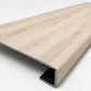 Custom square-nose stair tread made from LifeProof Navarra Maple Oak flooring. Square profile. Angled view.