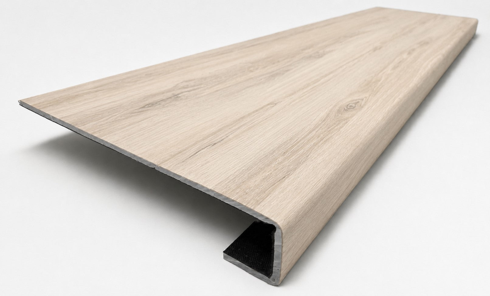 Custom square-nose stair tread made from LifeProof Navarra Maple Oak flooring. Square profile. Angled view.