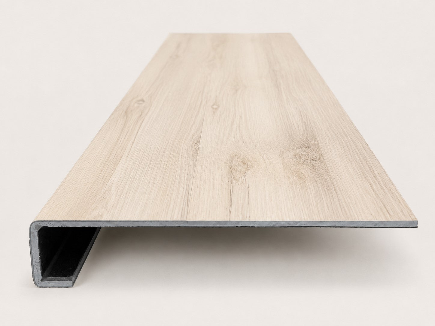 Custom square-nose stair tread made from LifeProof Navarra Maple Oak flooring. Square profile. Front view.
