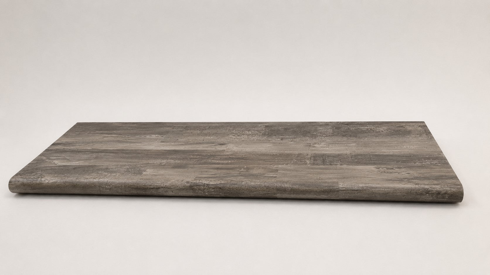 Custom round-nose stair tread made to match LifeProof Restored Wood flooring. Round profile. Full view.
