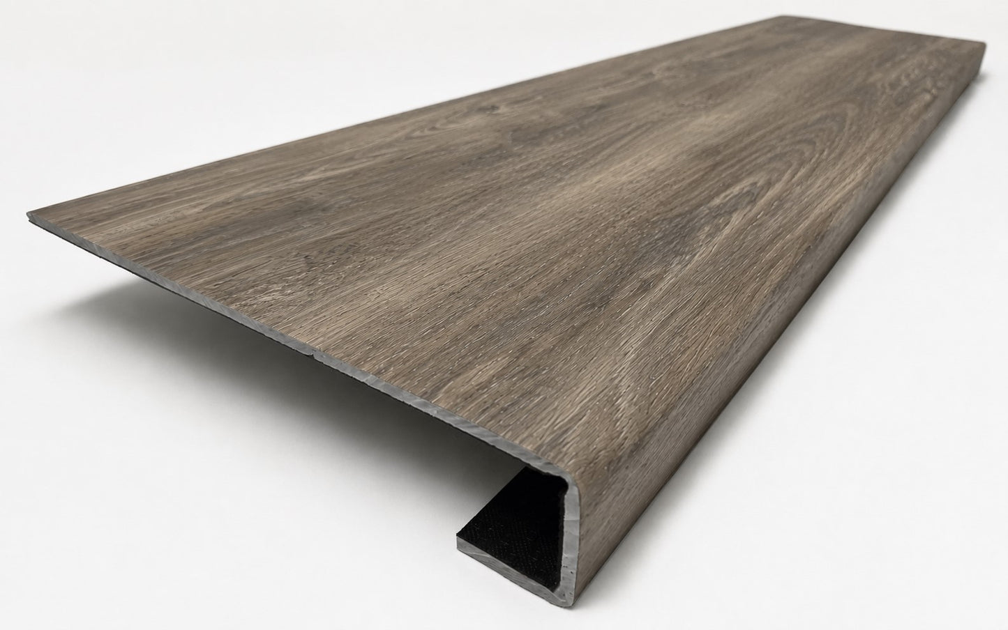 Custom square-nose stair tread made to match LifeProof Restored Wood flooring. Square profile. Angled view.