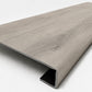 Custom square-nose stair tread made from LifeProof Sterling Oak flooring. Square profile. Angled view.