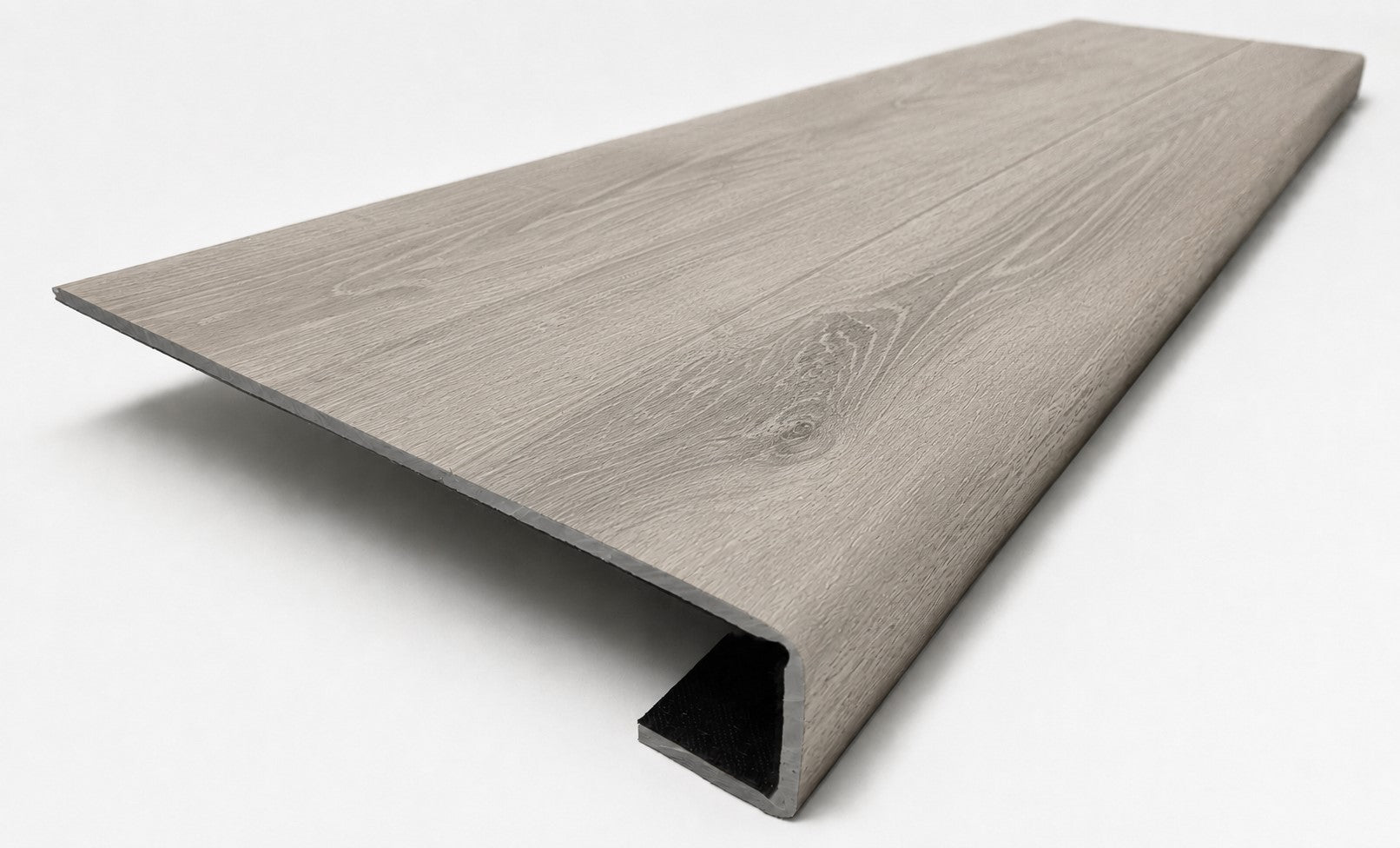 Custom square-nose stair tread made from LifeProof Sterling Oak flooring. Square profile. Angled view.