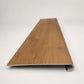 Custom round-nose stair tread made from LifeProof Trail Oak flooring. Round profile. Front view.