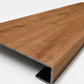 Custom square-nose stair tread made from LifeProof Trail Oak flooring. Square profile. Angled view.