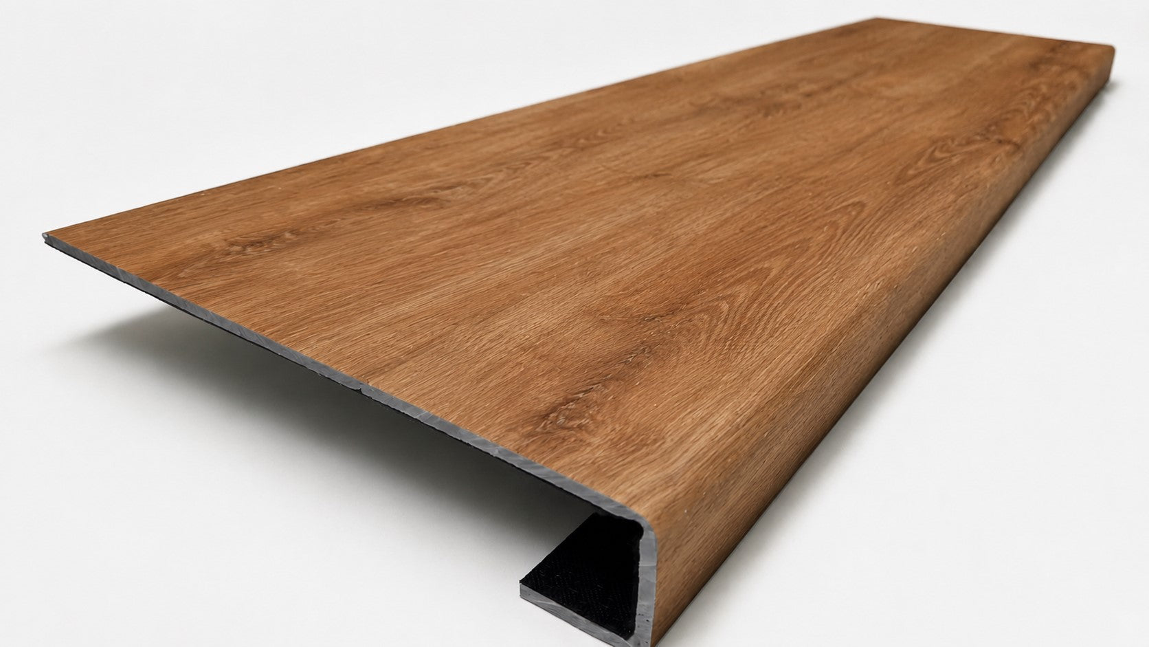 Custom square-nose stair tread made from LifeProof Trail Oak flooring. Square profile. Angled view.