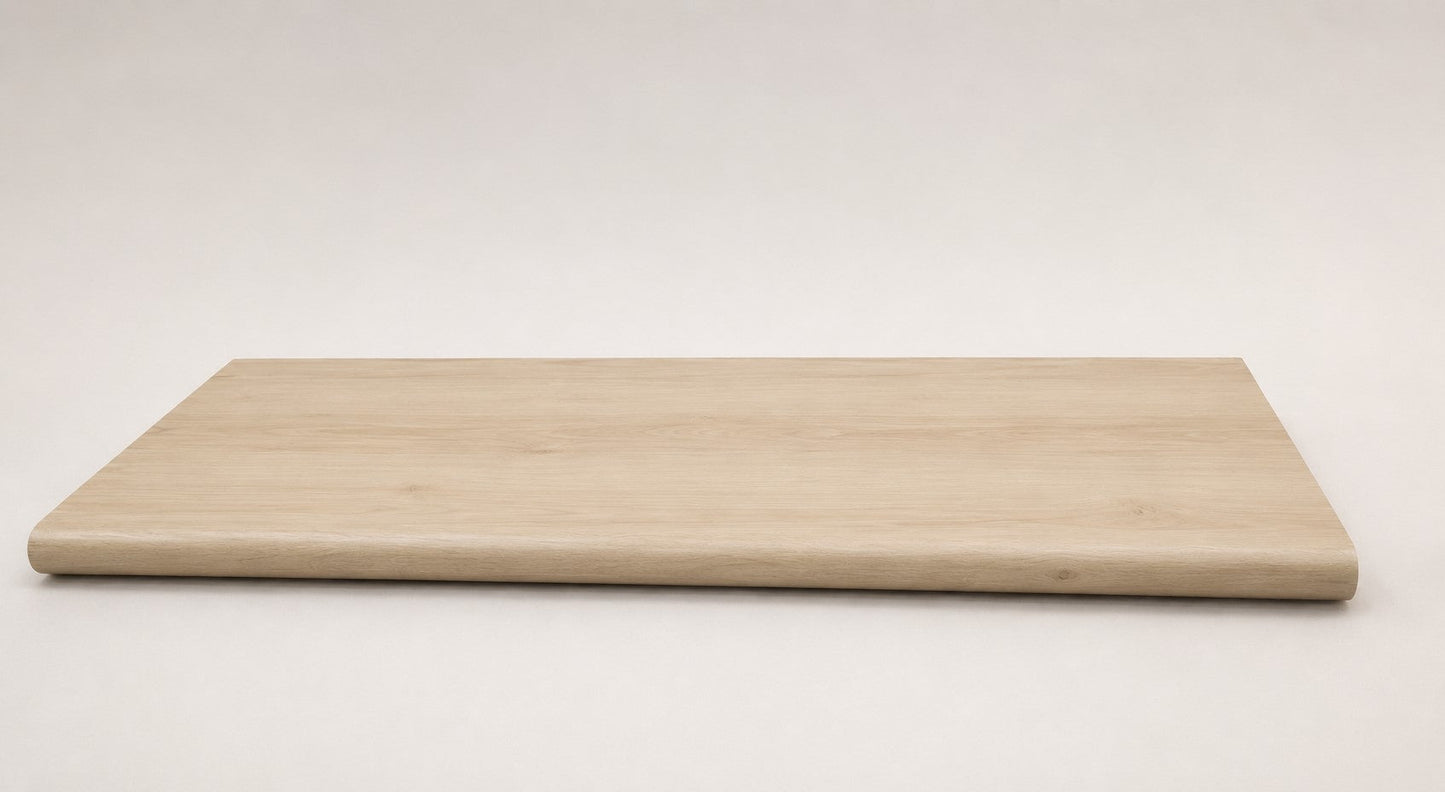 Custom round-nose stair tread made to match LifeProof Vesinet Oak flooring, featuring a light wood-look finish, continuous grain, and a smooth rounded profile for a clean stair transition. Full View