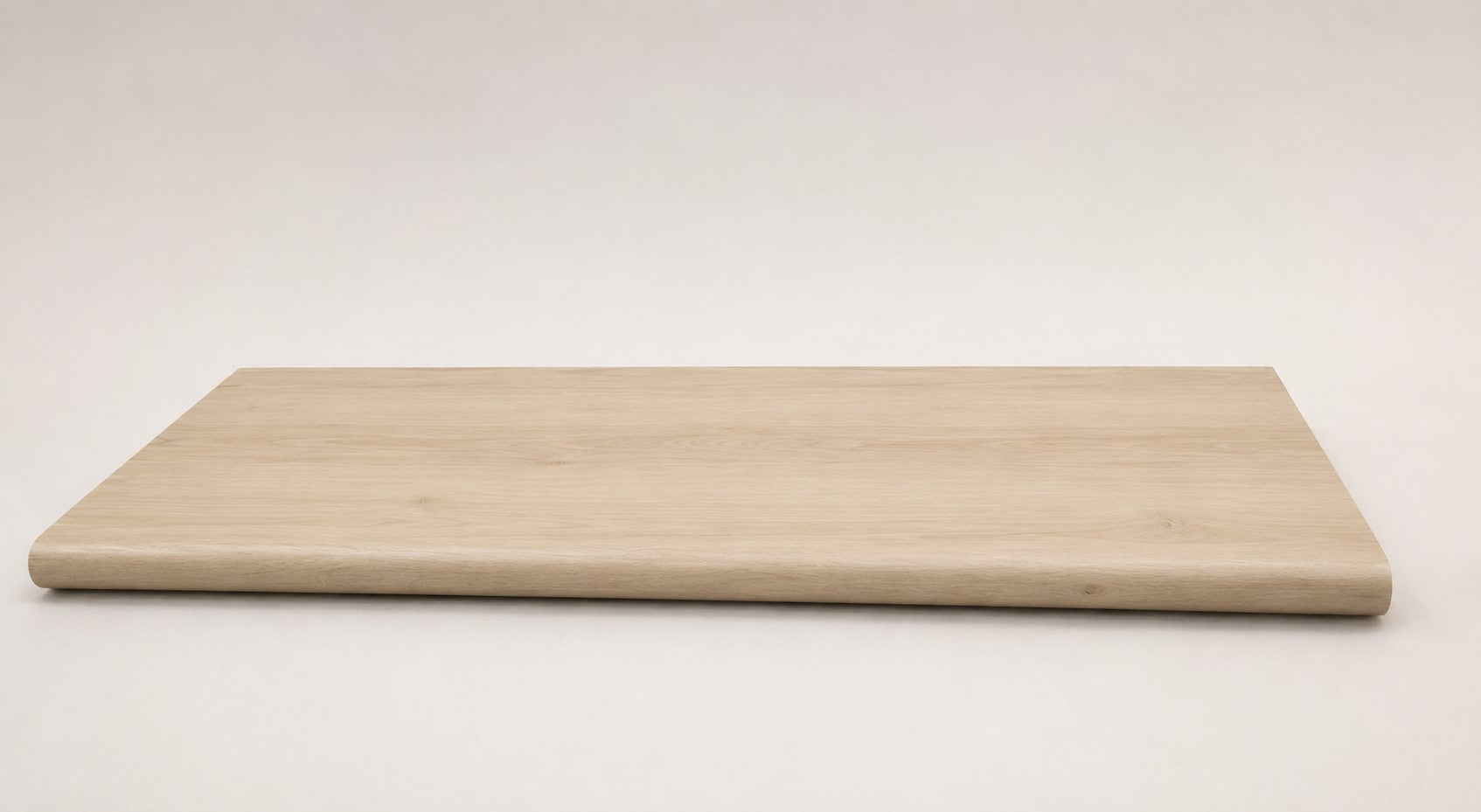 Custom round-nose stair tread made to match LifeProof Vesinet Oak flooring, featuring a light wood-look finish, continuous grain, and a smooth rounded profile for a clean stair transition. Full View