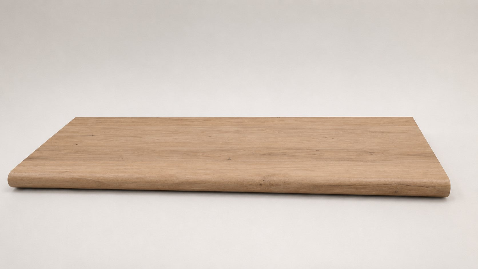 Custom round-nose stair tread made to match LifeProof Westminster Oak flooring. Round profile. Full view.
