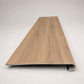 Custom round-nose stair tread made to match LifeProof Westminster Oak flooring. Round profile. Front view. 