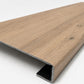 Custom square-nose stair tread made to match LifeProof Westminster Oak flooring. Square profile. Angled view.