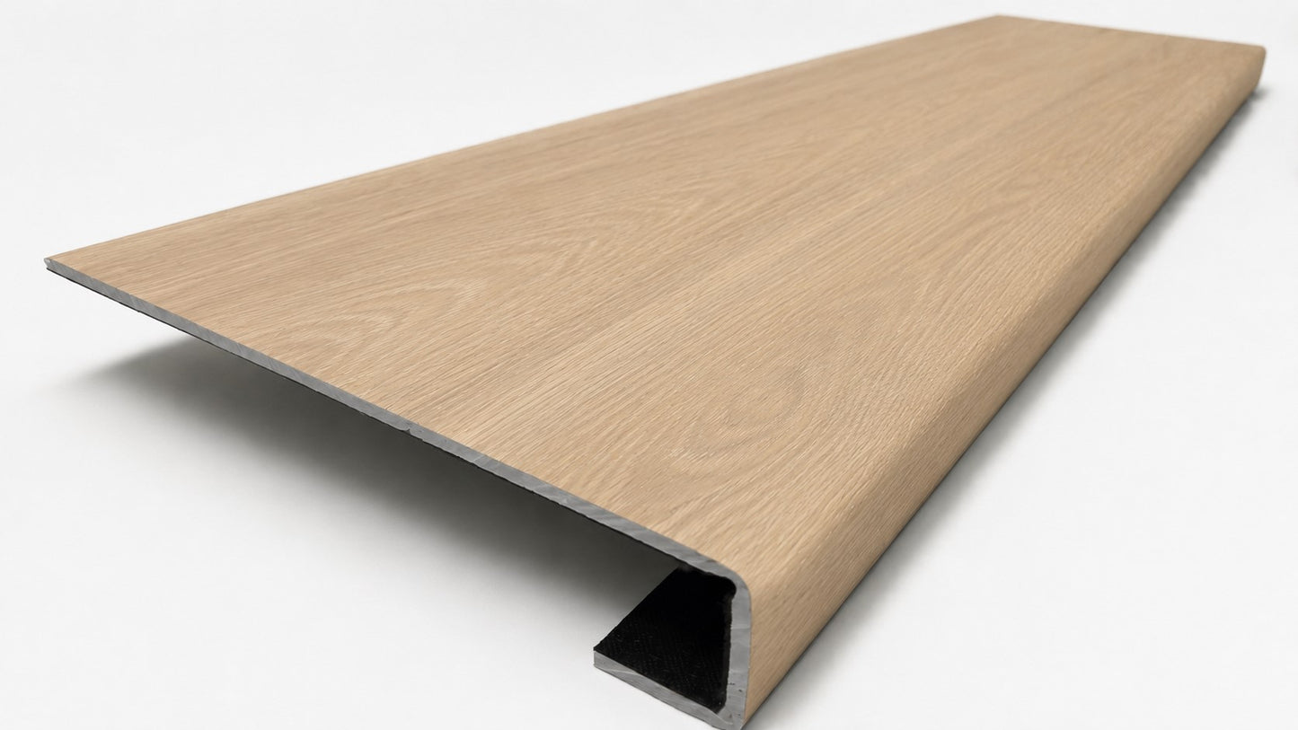 Custom square-nose stair tread made to match NuCore Caracal Crossing flooring. Square profile. Angled view.